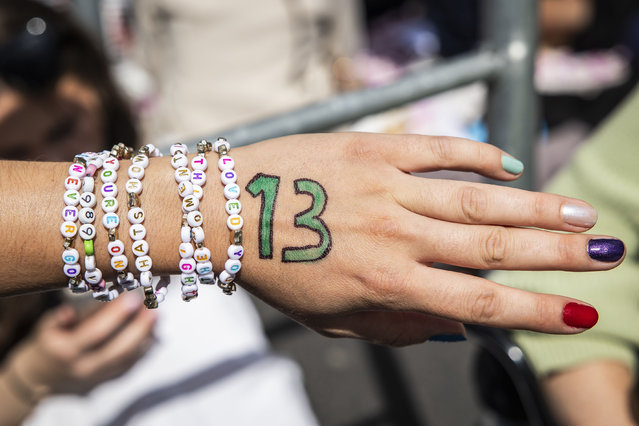 A pwerson wears bracelets as fans gather near the Johan Cruijff ArenA where “Swifties” – dedicated fans of the US singer – wait for a Taylor Swift concert, in Amsterdam, The Netherlands, 04 July 2024. The American singer's performance is one of three concerts in Amsterdam on three consecutive evenings, which are part of the artist's current “The Eras Tour”. (Photo by Dingena Mol/EPA/EFE/Rex Features/Shutterstock)