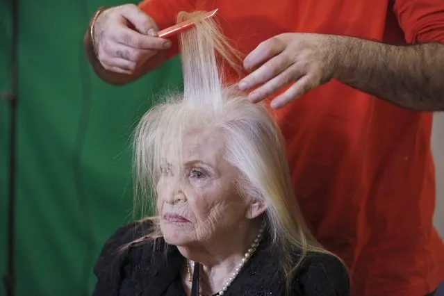 Sarah Israel, 85, a Holocaust survivor, has her hair done during preparations ahead of a beauty contest for survivors of the Nazi genocide in the northern Israeli city of Haifa, November 24, 2015. (Photo by Amir Cohen/Reuters)