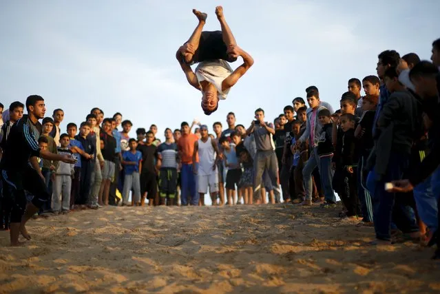 A Palestinian youth demonstrates his parkour skills at Shati refugee camp in Gaza City, November 27, 2015. (Photo by Mohammed Salem/Reuters)