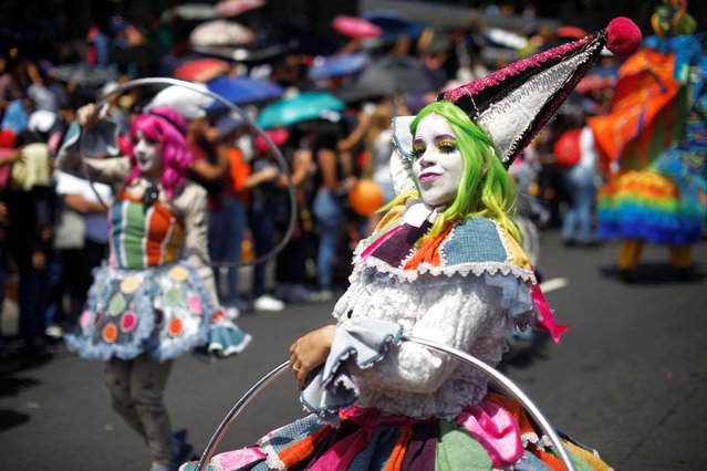 Dancers perform during the opening parade of the festivities of El Divino Salvador del Mundo (The Divine Savior of The World), patron saint of the capital city of San Salvador, El Salvador, on August 1, 2024. (Photo by Jose Cabezas/Reuters)