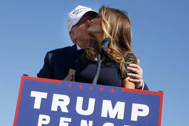 Republican presidential candidate Donald Trump, left, kisses his wife Melania during a campaign rally, Saturday, November 5, 2016, in Wilmington, N.C. (Photo by Evan Vucci/AP Photo)