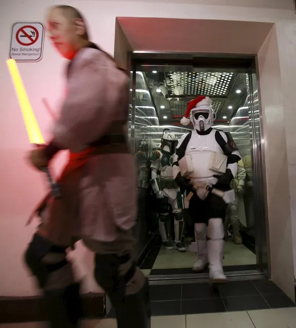 Cosplayers dressed as characters from the Star Wars movie series visit patients during a charity event organised by non-profit group 501st Legion, at East Avenue Medical Center in Quezon city, metro Manila December 6, 2015. (Photo by Romeo Ranoco/Reuters)