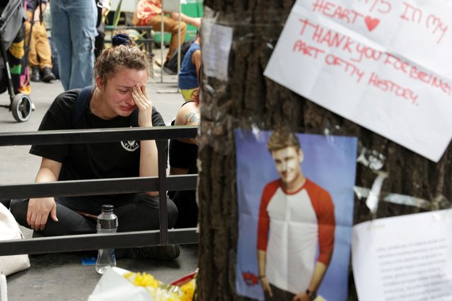 A person reacts at the Obelisk after Liam Payne, former One Direction band member, was found dead after he fell from a third-floor hotel room balcony, in Buenos Aires, Argentina, on October 17, 2024. (Photo by Tomas Cuesta/Reuters)