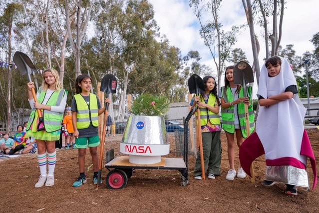 Students at Santiago STEAM Magnet Elementary School participate at a ceremony to plant a small Giant Sequoia tree from NASA's Artemis I Mission's tree seeds that traveled around the moon twice, after the school was honored in the spring of 2024 to become NASA Moon Tree Stewards in Lake Forest, Calif., on Monday, October 14, 2024. (Photo by Damian Dovarganes/AP Photo)