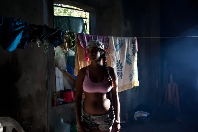 “Fisherman's daughter”. Woman patiently stands in the room of an abandoned sugar factory. Location: Cachoeira, Bahia, Brazil. (Photo and caption by Justin Meredith/National Geographic Traveler Photo Contest)