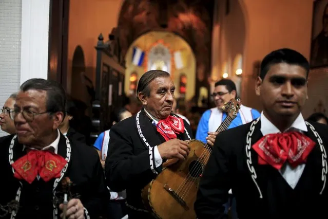 Mariachi musicians prepare to perform to celebrate the Day of the Virgin of Guadalupe outside the Basilica of Guadalupe in San Salvador, El Salvador December 11, 2015. (Photo by Jose Cabezas/Reuters)