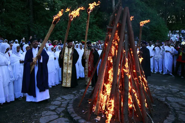 Religious leaders and members from six Ethiopian Orthodox Tewahedo Churches attend a bonfire lighting for the religious celebration of Meskel CQ in West Seattle's Camp Long Sunday, October 2, 2016. (Photo by Erika Schultz/The Seattle Times)