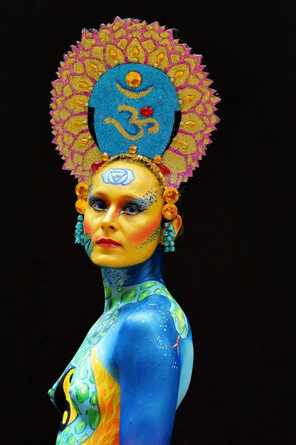 A participant poses with her body paintings designed by bodypainting artist Yasmina Jacinto during the 16th World Bodypainting Festival in Poertschach on July 6, 2013 in Poertschach am Woerthersee, Austria. (Photo by Didier Messens/Getty Images)