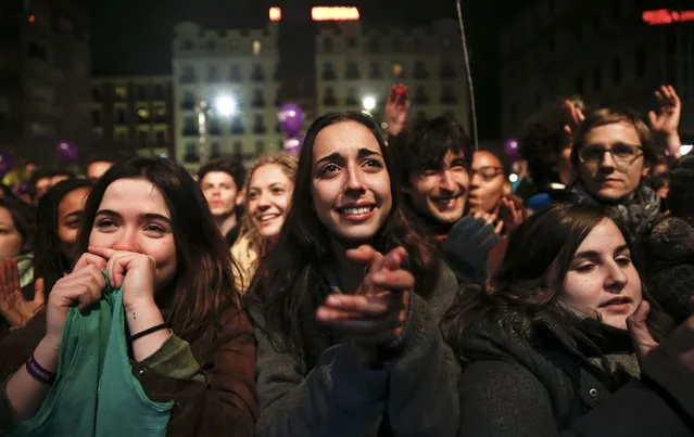 Podemos (We Can) party supporters react as party leader Pablo Iglesias and other members address the crowd after results were announced in Spain's general election in Madrid, Spain, December 21, 2015. (Photo by Sergio Perez/Reuters)