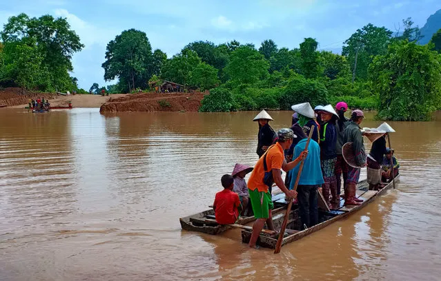Villagers are evacuated after the Xepian-Xe Nam Noy hydropower dam collapsed in Attapeu province, Laos on July 25, 2018. (Photo by Reuters/Stringer)