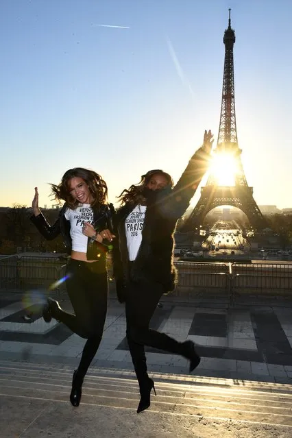 Alessandra Ambrosio and Jasmine Tookes pose in front of the Eiffel Tower prior the 2016 Victoria's Secret Fashion Show on November 29, 2016 in Paris, France. (Photo by Dimitrios Kambouris/Getty Images for Victoria's Secret)
