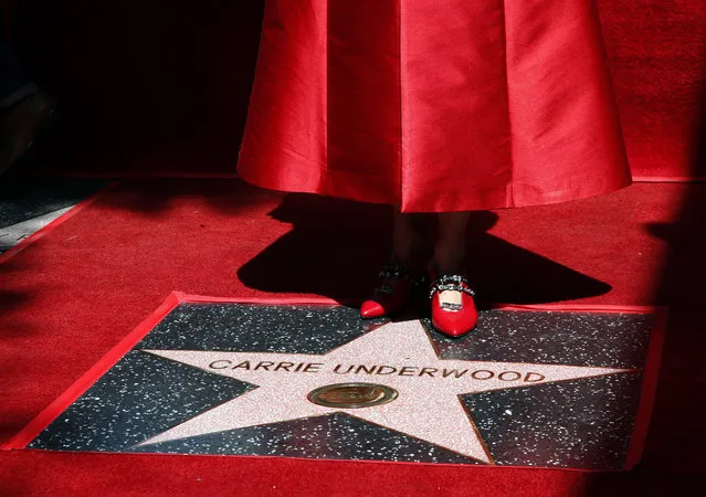 US singer Carrie Underwood stands on her star during a ceremony honoring her on the Hollywood Walk of Fame in Hollywood, California, USA, 20 September 2018. Underwood received the 2,646th star in the Recording category. (Photo by Mike Nelson/EPA/EFE)