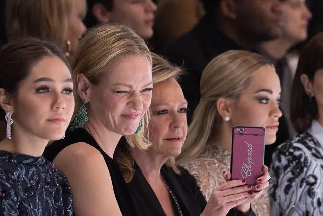 U.S actress Uma Thurman, second left, and British singer Rita Ora, right, attend Ralph&Russo's Spring-Summer 2016 Haute Couture fashion collection, presented in Paris, France, Monday, January 25, 2015. (Photo by Zacharie Scheurer/AP Photo)