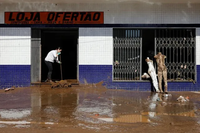 A resident cleans up a flooded area after an extratropical cyclone hit southern towns, in Mucum, Rio Grande do Sul, Brazil on September 6, 2023. (Photo by Diego Vara/Reuters)
