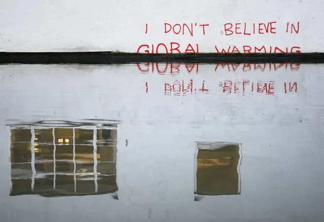 Graffiti art is seen on a wall next to the Regent's Canal, in Camden in London December 22, 2009. (Photo by Luke MacGregor/Reuters)