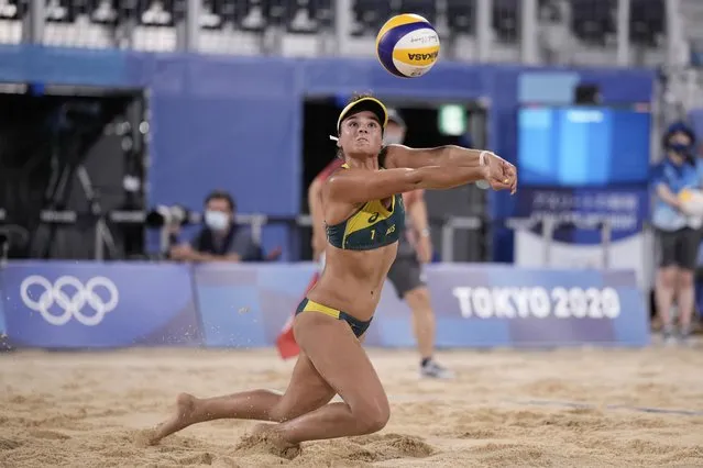 Mariafe Artacho del Solar, of Australia, stretches for the ball during a women's beach volleyball quarterfinal match against Canada at the 2020 Summer Olympics, Tuesday, August 3, 2021, in Tokyo, Japan. (Photo by Felipe Dana/AP Photo)