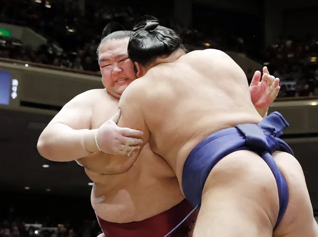 In this Tuesday, January 15, 2019, photo, grand champion Kisenosato, left, is pushed by Tochiozan at the New Year Grand Sumo Tournament in Tokyo. Kisenosato, the only Japanese wrestler at sumo's highest rank, has decided to retire after three straight losses at the tournament. (Photo by Kyodo News via AP Photo)