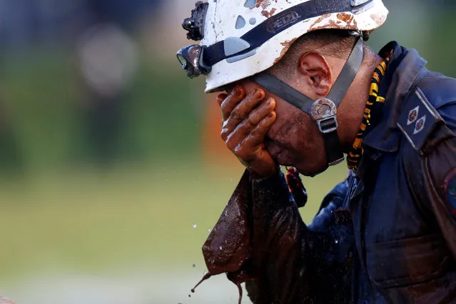 A member of rescue team reacts, upon returning from the mission, after a tailings dam owned by Brazilian mining company Vale SA collapsed, in Brumadinho, Brazil on January 27, 2019. (Photo by Adriano Machado/Reuters)