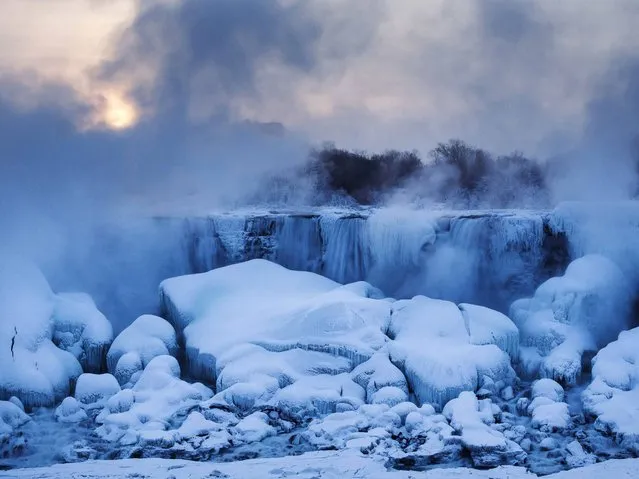 Icy mist rises over the Horseshoe Falls section of Niagara Falls during freezing temperatures. (Photo by Mark Blinch/Reuters)