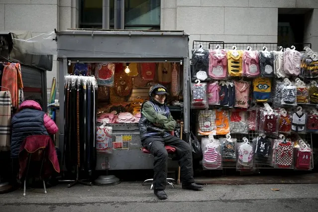 A shopkeeper naps at the Namdaemun Market in Seoul, South Korea, November 24, 2015. (Photo by Kim Hong-Ji/Reuters)