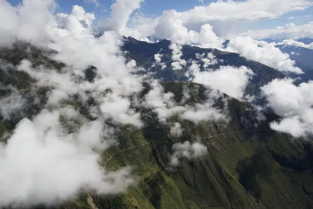 An aerial view of the mountainous terrain seen from a military helicopter, near Surcubamba, Peru,  Thursday, May 21, 2015. (Photo by Rodrigo Abd/AP Photo)