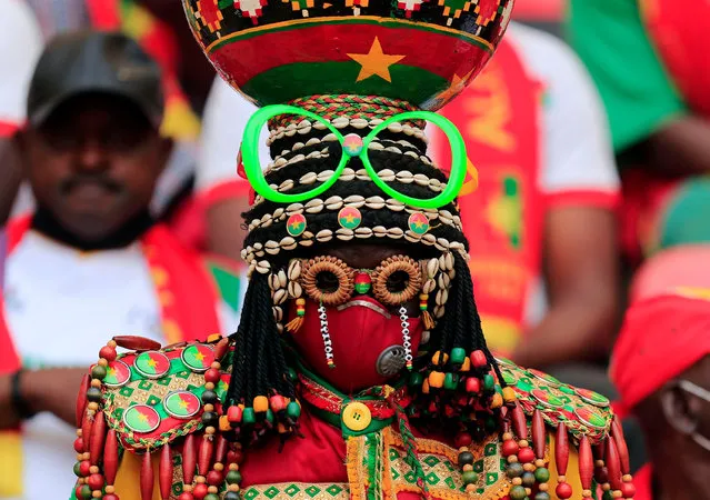 A fan wears a costume at the Africa Cup of Nations game between Cameroon and Ethiopia at Stade d’Olembe, Cameroon on January 13, 2022. (Photo by Thaier Al-Sudani/Reuters)