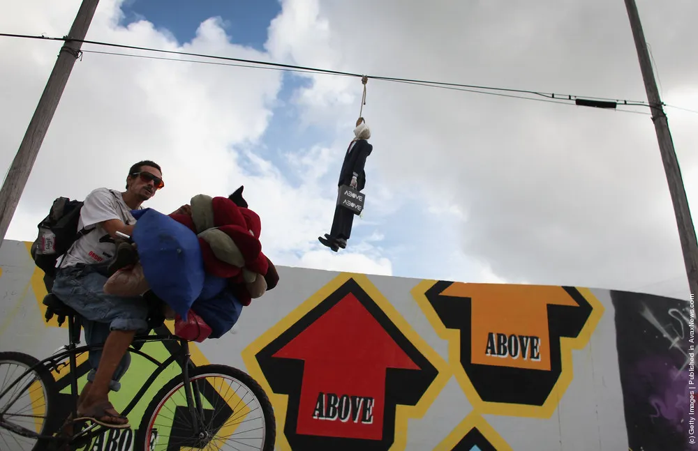 Effigy Of Wall Street Banker Hangs By Freeway In Miami