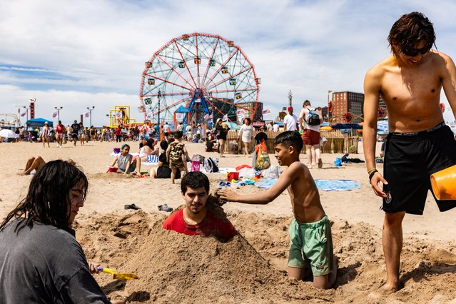People enjoy the day at Coney Island during Memorial Day weekend celebrations in New York on May 25, 2024. (Photo by Jeenah Moon/Reuters)