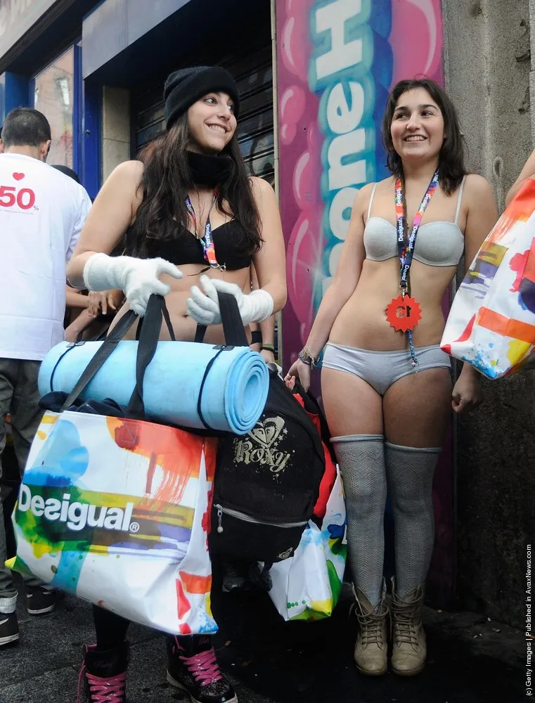 Semi-Nude Shoppers Queue for Free Clothes in Madrid Sales