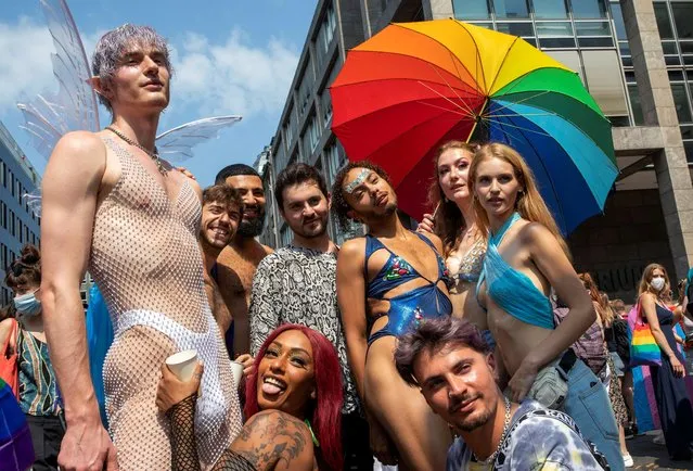 Participants take part in the annual Christopher Street Day parade with the motto “Save Our Community – Save Your Pride” in Berlin on July 24, 2021, amid the ongoing COVID-19 coronavirus pandemic. (Photo by Reuters/Stringer)