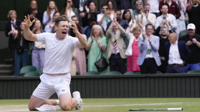 Harri Heliovaara of Finland celebrates after he and partner Henry Patten of Britain defeated Australia's Max Purcell and compatriot Jordan Thompson in the men's doubles final at the Wimbledon tennis championships in London, Saturday, July 13, 2024. (Photo by Alberto Pezzali/AP Photo)