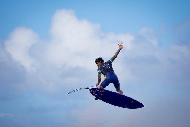 Gabriel Medina, of Brazil, performs an aerial move as he surfs during a training day ahead the 2024 Summer Olympics surfing competition Wednesday, July 24, 2024, in Teahupo'o, Tahiti. (Photo by Gregory Bull/AP Photo)