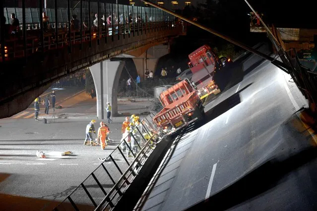 Rescue team works on the highway collapsed in Wuxi city, east China's Jiangsu province, 10 October 2019. China National Highway 312 Wuxi Section collpased, causing 3 vehicles buried, 3 people died and 2 injuried in Wuxi city, east China's Jiangsu province, 10 October 2019. (Photo by Reuters/China Daily)