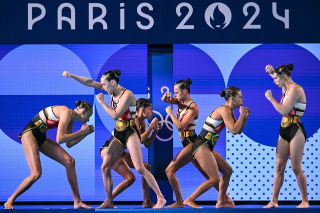 Team Canada compete in the team free routine of the artistic swimming event during the Paris 2024 Olympic Games at the Aquatics Centre in Saint-Denis, north of Paris, on August 6, 2024. (Photo by Oli Scarff/AFP Photo)