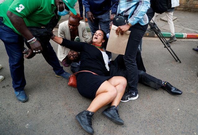 Plainclothes police officers attempt to detain Kenyan activist Boniface Mwangi, along with other social justice activists, in front of the Office of the President as families of the victims, activists and civil society representatives gather to deliver a list of people who disappeared during demonstrations against the government proposed tax hikes, in Nairobi, Kenya on September 24, 2024. (Photo by Thomas Mukoya/Reuters)