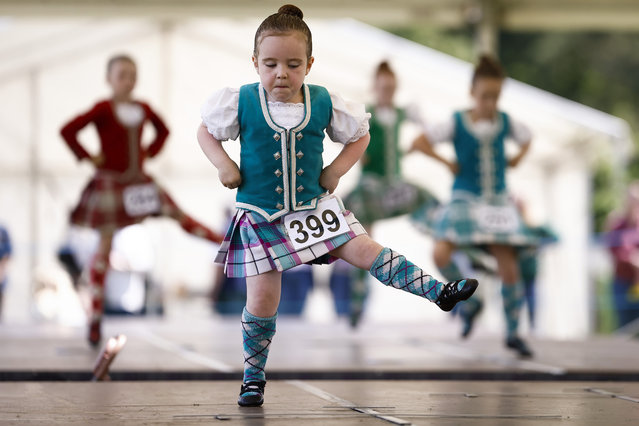 Dancers compete during the Inveraray Highland Games on July 18, 2023 in Inveraray, Scotland. The games held annually in the grounds of Inveraray Castle. They celebrate Scottish culture and heritage with field and track events, piping, highland dancing competitions and heavy events including the world championships for tossing the caber (Photo by Jeff J. Mitchell/Getty Images)