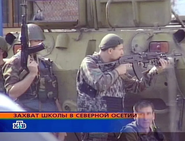 A TV grab from Russian NTV channel showing a special forces soldiers on their position at the local school building, captured by the terrorists, Beslan, North Ossetia, Wednesday, 01 September 2004. (Photo by EPA/NTV)