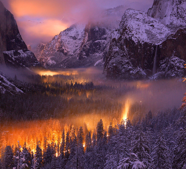 Yosemite Valley at Dusk: A mist had settled over Yosemite Valley, as automobiles passed through, headlights illuminated the fog. (Photo by Phil Hawkins/National Geographic Photo Contest
