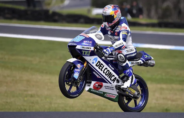 Spain's Moto3 rider Jorge Martin celebrates on his Honda after qualifying in pole position for the Australian Motorcycle Grand Prix at Phillip Island near Melbourne, Australia, Saturday, October 21, 2017. (Photo by Andy Brownbill/AP Photo)