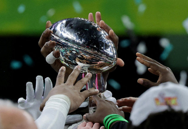 Philadelphia Eagles celebrate with the Vince Lombardi Trophy after winning Super Bowl LIX on February 9, 2025. (Photo by Mike Segar/Reuters)