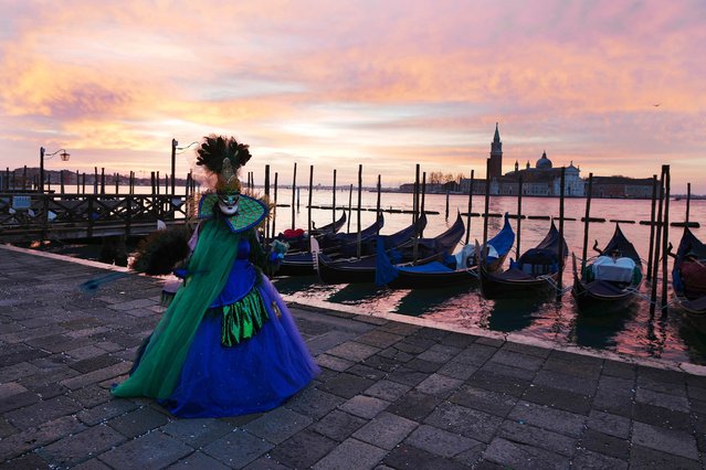 A woman wears mask in St. Marks square during the historical Venice Carnival, in Venice, Italy, Sunday, February 16, 2025. (Photo by Antonio Calanni/AP Photo)