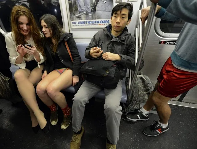 Some riders in the New York City subway in the underwear as the take part in the 2013 No Pants Subway Ride January 13, 2013. Started by Improv Everywhere, the goal is for riders to get on the subway train dressed in normal winter clothes (without pants) and keep a straight face.  AFP PHOTO / TIMOTHY A. CLARY        (Photo credit should read TIMOTHY A. CLARY/AFP/Getty Images)