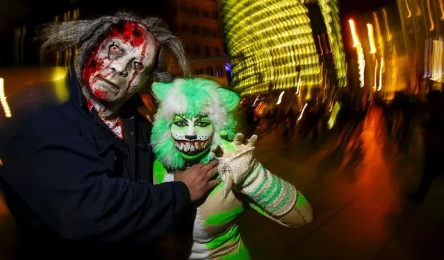 People dressed as horror figures promote an upcoming horror show at the Filmpark Babelsberg theme park at Potsdamer Platz square in Berlin, Germany, October 9, 2015. (Photo by Hannibal Hanschke/Reuters)