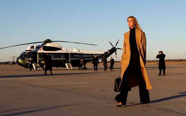 Ivanka Trump walks from Air Force One to a waiting vehicle upon arrival, as U.S. President Donald Trump boards Marine One in the background, at Joint Base Andrews in Maryland, U.S., January 18, 2018. (Photo by Kevin Lamarque/Reuters)