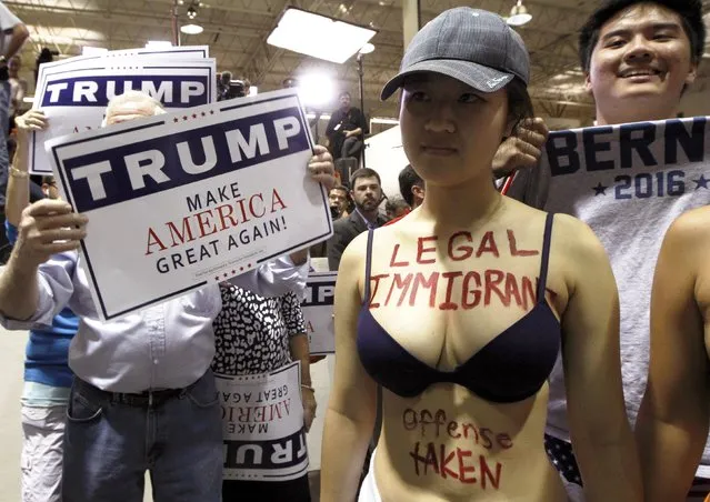 A protestor opposed to U.S. Republican presidential candidate Donald Trump's stance on immigration clashes with Trump supporters at a rally in Norcross, Georgia October 10, 2015. (Photo by Tami Chappell/Reuters)