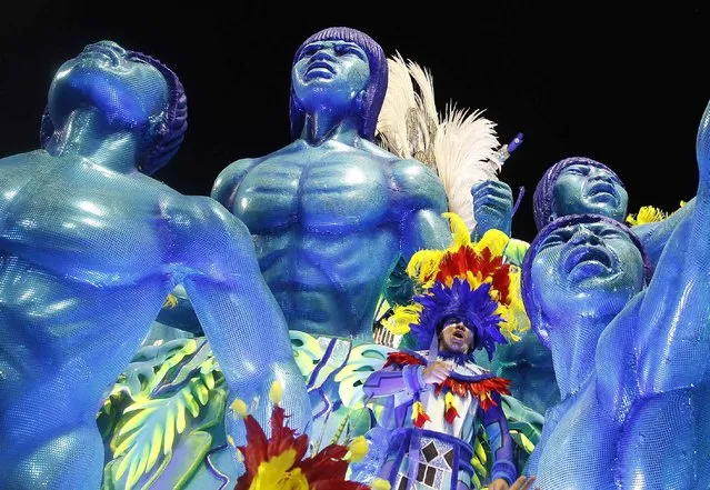 A reveller of Portela samba school participates in the annual Carnival parade in Rio de Janeiro's Sambadrome February 11, 2013. (Photo by Pilar Olivares/Reuters)