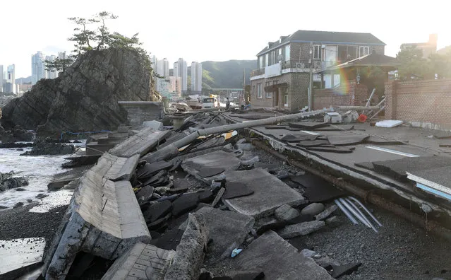 A road damaged by typhoon Haishen is pictured in Ulsan, South Korea, September 7, 2020. (Photo by Yonhap via Reuters)