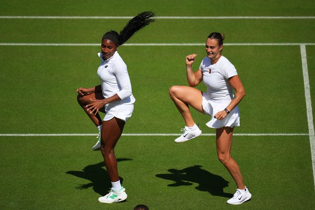 Aryna Sabalenka of Belarus, right, and Coco Gauff of United States dance during a practice session ahead of the Wimbledon Championships in London, Friday, June 27, 2025. (Photo by Kin Cheung/AP Photo)