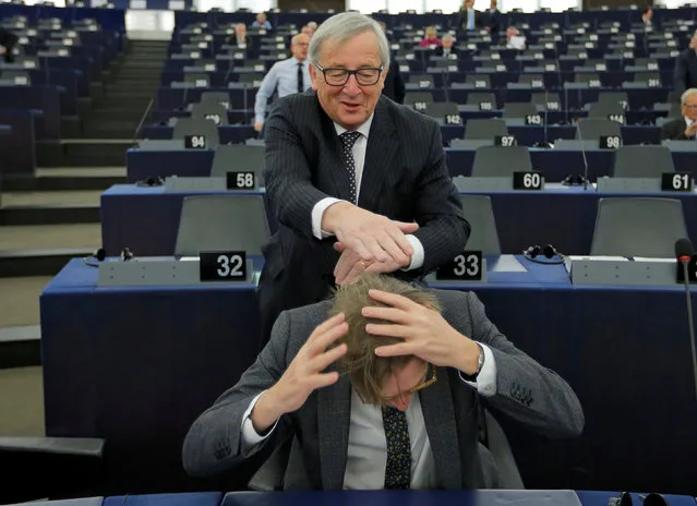 European Commission President Jean-Claude Juncker jokes with European Union's chief Brexit negotiator Guy Verhofstadt ahead of a debate on the Future of Europe at the European Parliament in Strasbourg, France, February 6, 2018. (Photo by Vincent Kessler/Reuters)