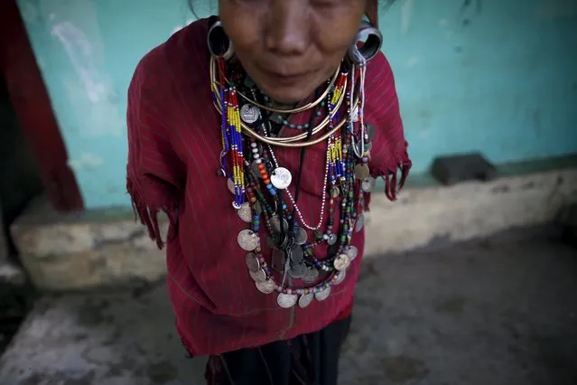 An ethnic Kayaw woman wears necklaces made with old coins at Htaykho village in the Kayah state, Myanmar September 12, 2015. With about 30,000 members, the Kayaw are one of the smallest ethnic minorities among Myanmar's 135 groups. Their village has for decades been off-limits, as armed rebels fought the military before a recent ceasefire stopped the bloody conflict here. (Photo by Soe Zeya Tun/Reuters)